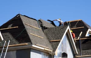 putting shingles on the roof